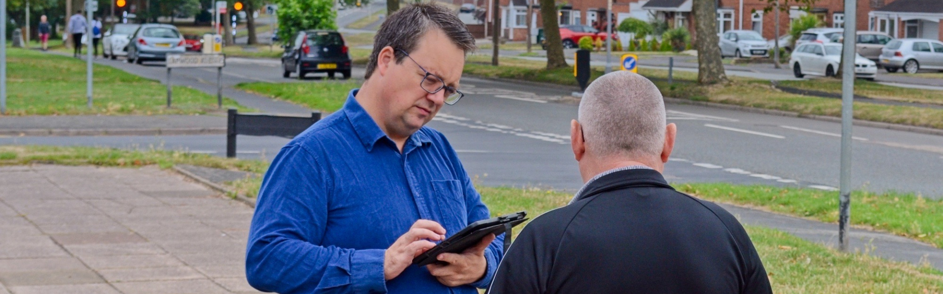 Mike talking to a constituent on one of his "Tell Mike" summer tours