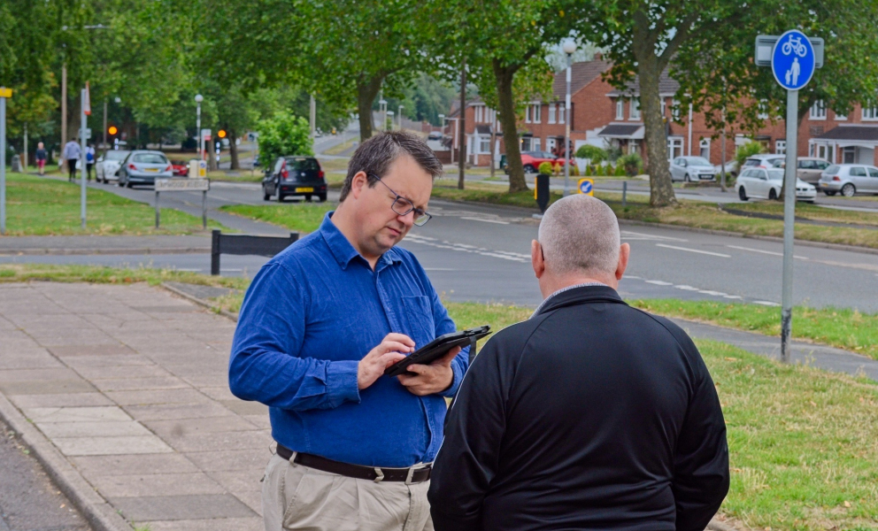 Mike talking to a constituent on one of his "Tell Mike" summer tours