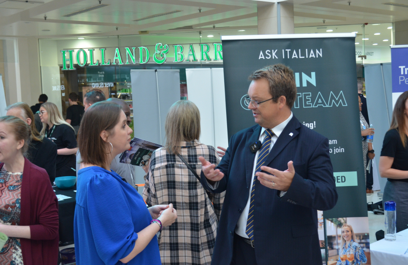 Mike talks to a local employer at his 2023 Jobs & Skills Fair