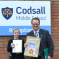 Mike with Christmas card competition winner Isla Gaunt at Codsall Middle School