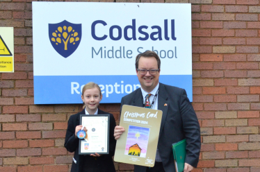 Mike with Christmas card competition winner Isla Gaunt at Codsall Middle School